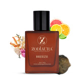 A bottle of Zodiaura Breeze Perfume EDP Spray for Men with citrus fruits and flowers arranged around it.