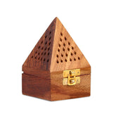 A triangular wooden incense burner with a geometric pattern and a brass clasp on the side.